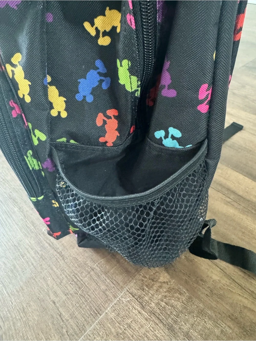 Disney park’s exclusive Black Backpack with Multi-Color Mickey Print